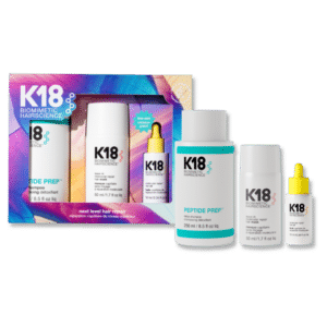 Imagen del kit de reparación capilar K18 Next Level Hair Repair, que incluye el shampoo detox PEPTIDE PREP™, la mascarilla molecular repair y un mini aceite K18. Ideal para limpieza profunda, reparación y control del frizz. Envase colorido con detalles del producto.