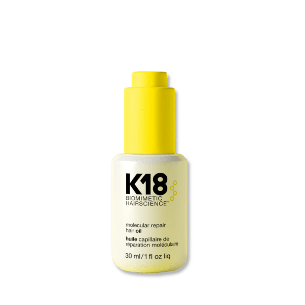 Botella de aceite capilar K18 Molecular Repair de 30 ml con dispensador amarillo sobre fondo blanco. El envase es blanco con letras negras y detalles amarillos.
